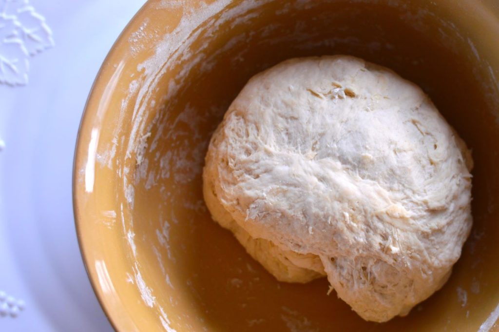 bowl of English muffin dough ball after fully mixed