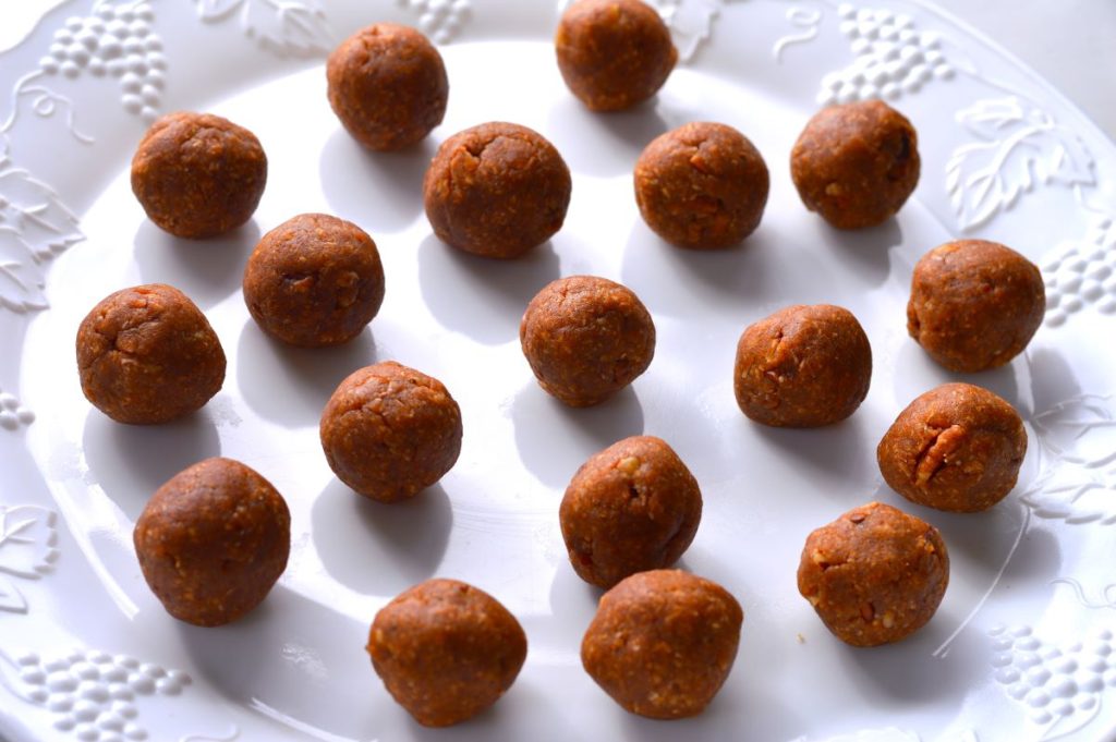 white serving tray with 18 peanut butter balls spread out